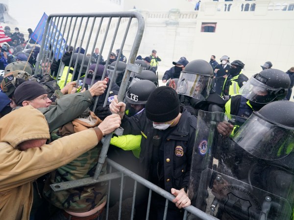 WASHINGTON, DC - JANUARY 06:  Police try to hold back protesters who  gather storm the Capitol and halt a joint session of the 117th Congress on Wednesday, Jan. 6, 2021 in Washington, DC. (Kent Nishimura / Los Angeles Times)