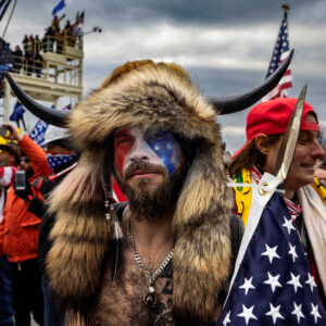WASHINGTON D.C., USA - JANUARY 6: Jacob Anthony Angeli Chansley, known as the QAnon Shaman, is seen at the Capital riots. On January 9, Chansley was arrested on federal charges of "knowingly entering or remaining in any restricted building or grounds without lawful authority, and with violent entry and disorderly conduct on Capitol grounds"Trump supporters clashed with police and security forces as people try to storm the US Capitol in Washington D.C on January 6, 2021. Demonstrators breeched security and entered the Capitol as Congress debated the 2020 presidential election Electoral Vote Certification. (photo by Brent Stirton/Getty Images)