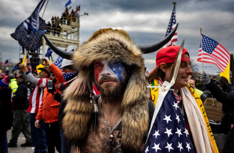 WASHINGTON D.C., USA - JANUARY 6: Jacob Anthony Angeli Chansley, known as the QAnon Shaman, is seen at the Capital riots. On January 9, Chansley was arrested on federal charges of "knowingly entering or remaining in any restricted building or grounds without lawful authority, and with violent entry and disorderly conduct on Capitol grounds"Trump supporters clashed with police and security forces as people try to storm the US Capitol in Washington D.C on January 6, 2021. Demonstrators breeched security and entered the Capitol as Congress debated the 2020 presidential election Electoral Vote Certification. (photo by Brent Stirton/Getty Images)