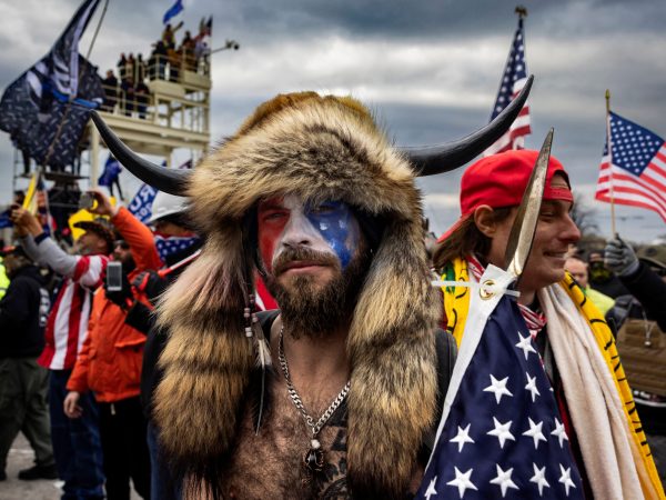 WASHINGTON D.C., USA - JANUARY 6: Jacob Anthony Angeli Chansley, known as the QAnon Shaman, is seen at the Capital riots. On January 9, Chansley was arrested on federal charges of "knowingly entering or remaining in any restricted building or grounds without lawful authority, and with violent entry and disorderly conduct on Capitol grounds"Trump supporters clashed with police and security forces as people try to storm the US Capitol in Washington D.C on January 6, 2021. Demonstrators breeched security and entered the Capitol as Congress debated the 2020 presidential election Electoral Vote Certification. (photo by Brent Stirton/Getty Images)
