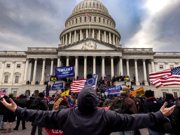 nation's capital to protest the ratification of President-elect Joe Biden's Electoral College victory over President Trump in the 2020 election. A pro-Trump mob later stormed the Capitol, breaking windows and clashing with police officers. Five people died as a result.  (Photo by Brent Stirton/Getty Images)