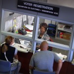 MIAMI, FL - OCTOBER 01:  Dorothy Torrence, from the Miami-Dade Elections Department, helps Yarelis Alvarez (L) and Alberto Alvarez fill out their voter registration forms on October 1, 2012 in Miami, Florida. As the October 9th deadline for people to register to vote in the upcoming election approaches according to the Florida Department of State, the number of people registering to vote is now averaging between 1,500 and 3,000 a day. After months of the Democrats questioning the motives of the Republican led legislator to purge non citizens and roll back early voting, the Republican Party was accused of using a firm to register voters that was providing false voter registration information. (Photo by Joe Raedle/Getty Images)