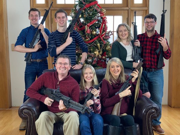 Massie family holding guns