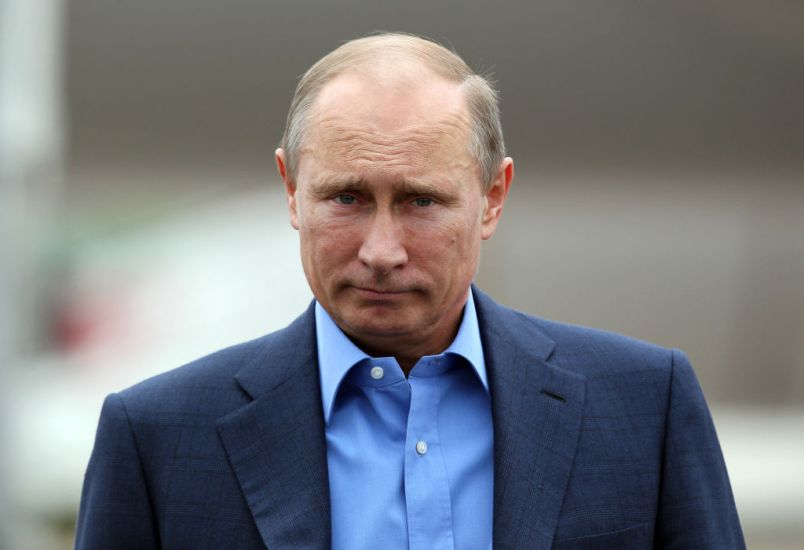 Russian President Vladimir Putin arrives at Belfast International airport in Belfast, Northern Ireland, on June 17, 2013, to attend the G8 summit at the Lough Erne resort. US President Barack Obama was to meet Putin for potentially vexatious talks, as both leaders now offer open military backing to rival sides in Syria's civil war. AFP PHOTO/ PETER MUHLY