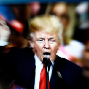 A slow shutter speed image of former US president Donald Trump on a TV screen is seen in this photo illustration in Warsaw, Poland on 23 February, 2022. (Photo by STR/NurPhoto)