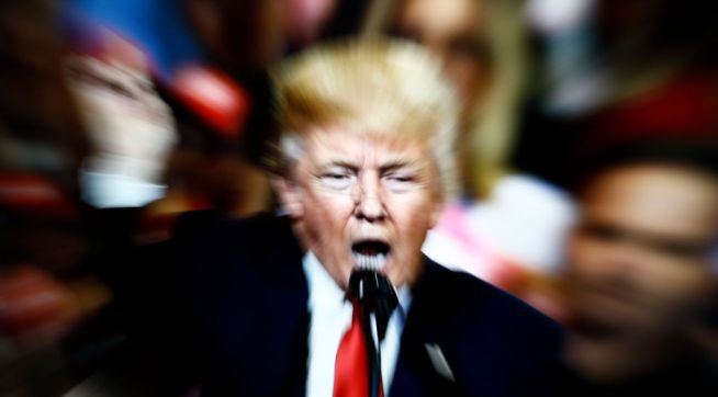 A slow shutter speed image of former US president Donald Trump on a TV screen is seen in this photo illustration in Warsaw, Poland on 23 February, 2022. (Photo by STR/NurPhoto)