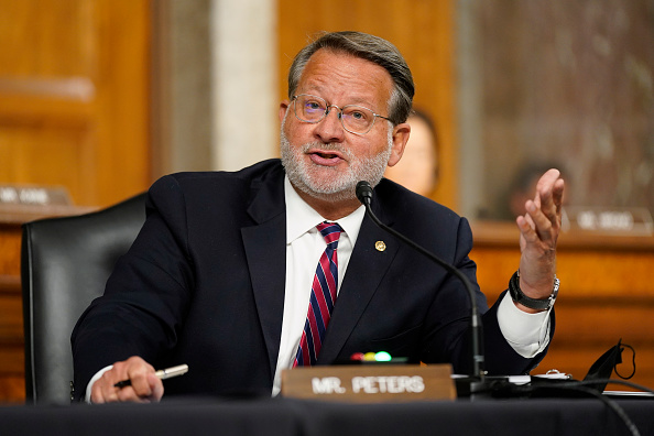 Senator Gary Peters, a Democrat from Michigan, speaking before a mic at a congressional hearing.