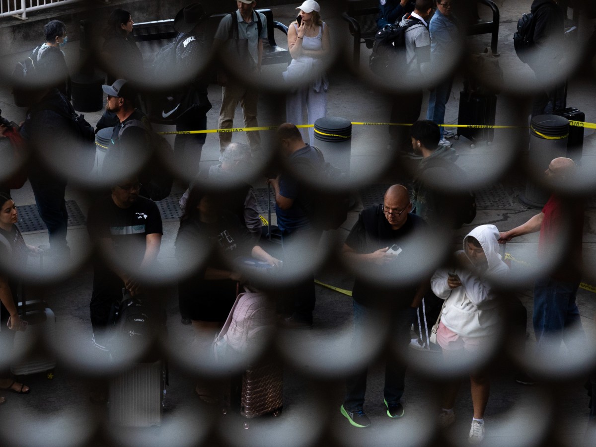 PHOTOS: Airline Travelers Encounter Armed ICE Agents at Airports Across the Country